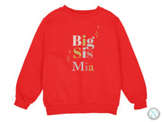 a red sweatshirt with the words big sis mia on it