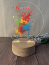 a personalized glass award with a wooden base