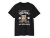 a black t - shirt with an image of a cat&#39;s face