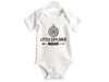 a white bodysuit with the words little explorer noah printed on it