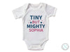 a white bodysuit that says tiny but mighty sophiia