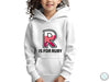 a young girl wearing a white hoodie with the letter r is for ruby