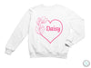 a white sweatshirt with the word daisy printed on it