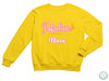 a yellow sweatshirt with pink lettering that says fabulous