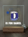 a glass block with the letter d on it