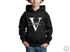 a young boy wearing a black hoodie with a v on it