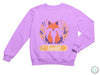 a purple sweatshirt with a picture of a fox on it