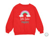 a red sweatshirt with a rainbow and the words little sister harper